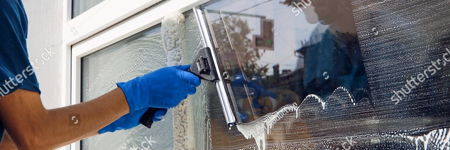 stock photo an employee of a professional cleaning service in overalls washes the glass of the windows of the 2075456665