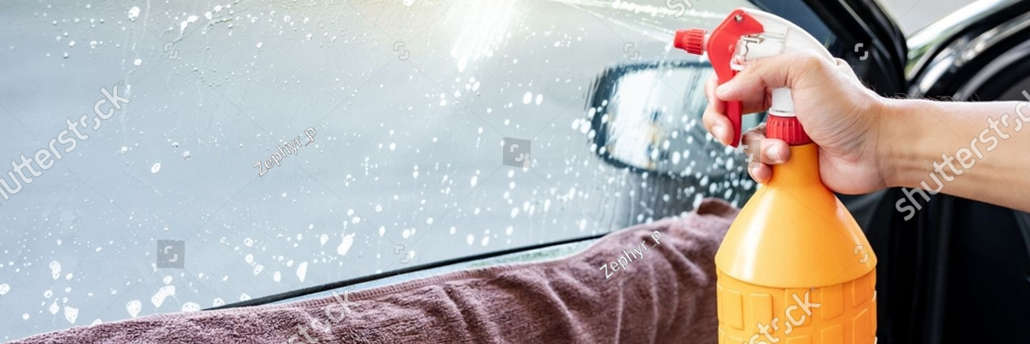 stock photo auto specialist worker hand using foggy spray bottle spraying soapy solution or ammonia fumes for 2313468581