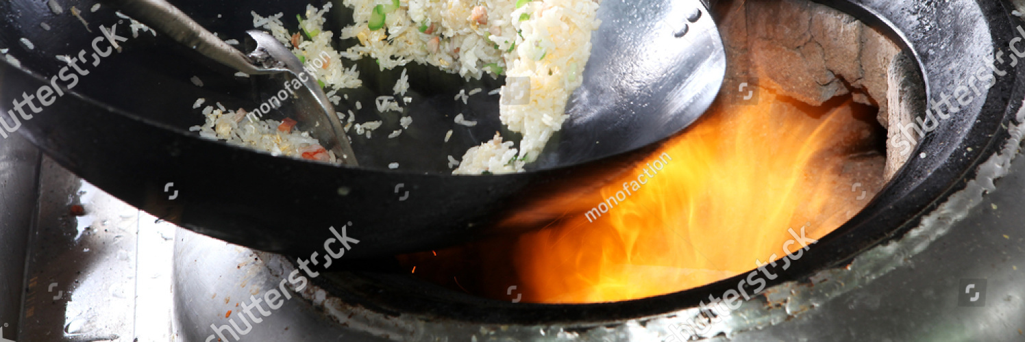 stock photo chef cooking fried rice with flame in a frying pan on a kitchen stove chinese style 301914686