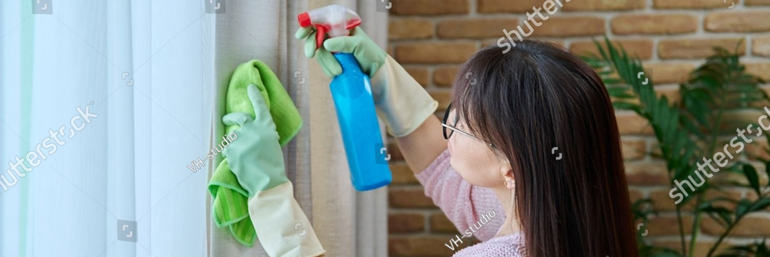 stock photo close up of woman in gloves cleaning curtains 2373713647