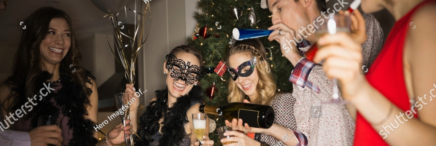 stock photo friends celebrating new years eve party at home 2216513685