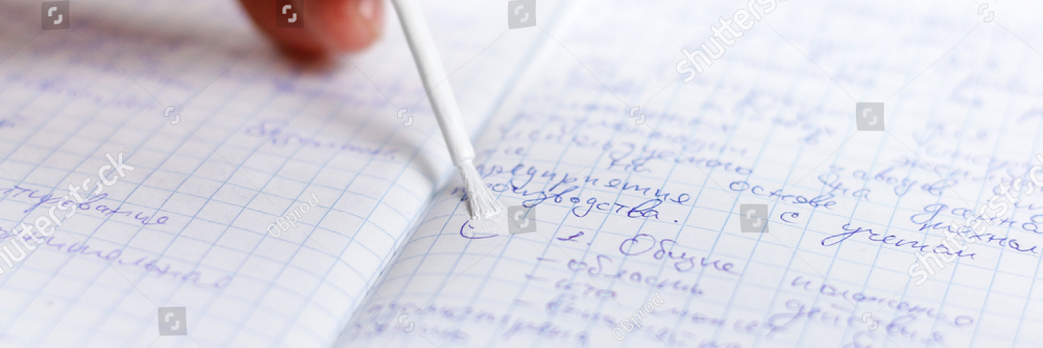 stock photo hand holding white corrector for text in the notebook causes concealer on handwritten text 743308636