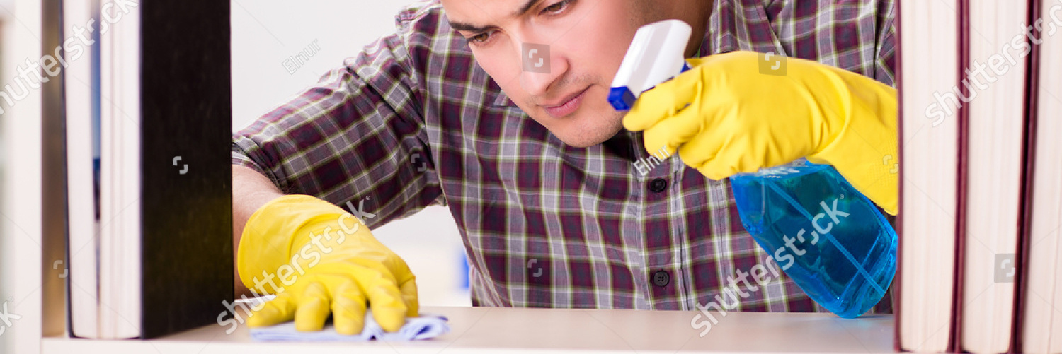 stock photo man cleaning dust from bookshelf 609170747