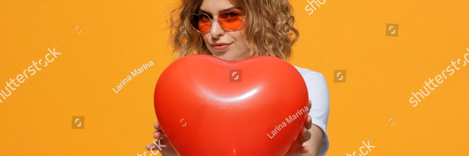 stock photo portrait happy woman with red heart balloon holding in her hands imitating how heart beats in front 1833423484