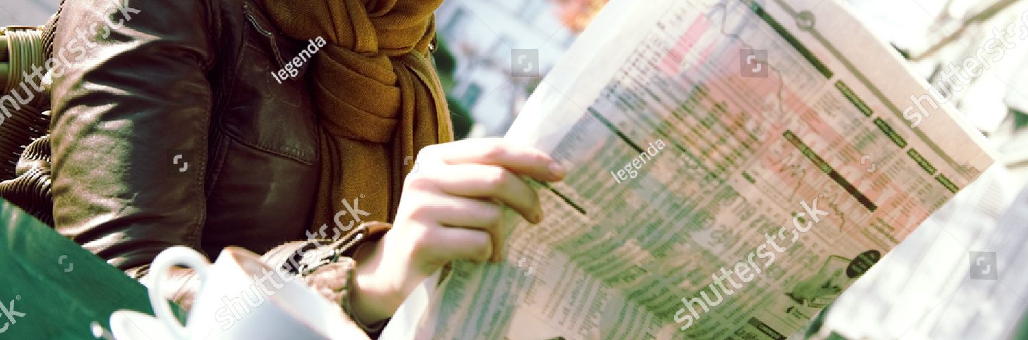 stock photo smiling woman reading newspaper in the outdoor cafe 137884217