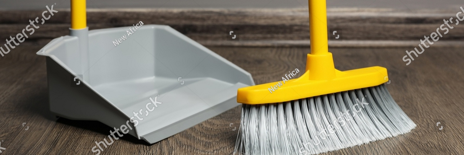 stock photo sweeping wooden floor with plastic broom and dustpan indoors 2124184040