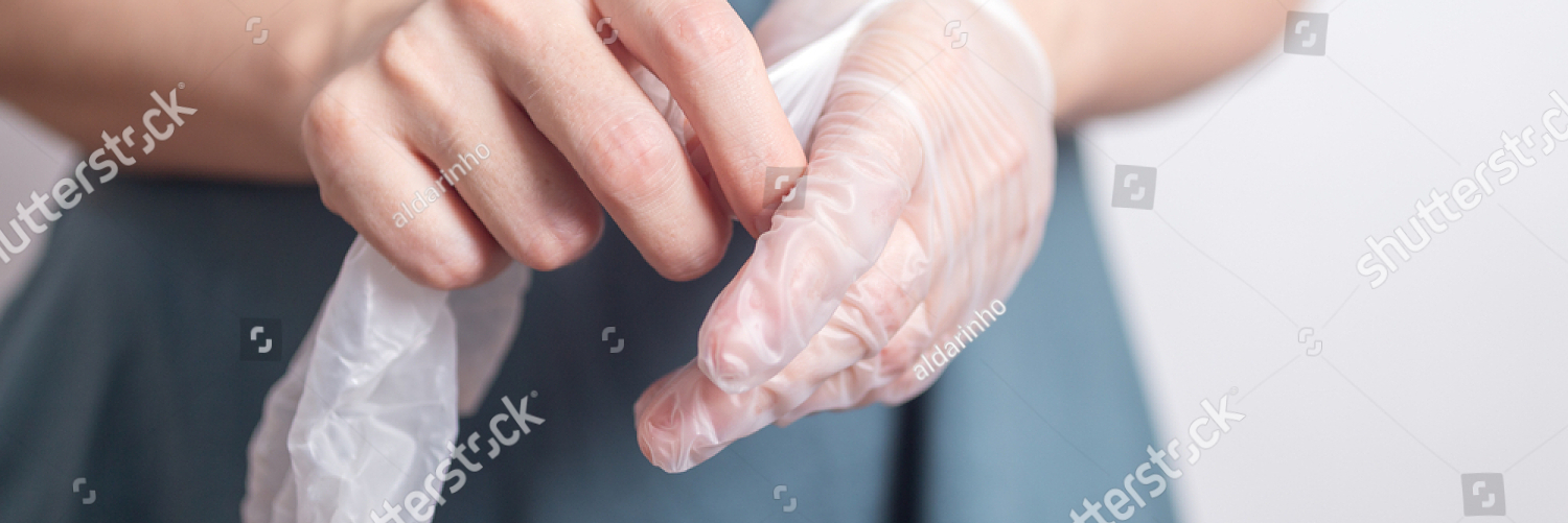 stock photo woman taking off latex disposable surgical gloves 1685305894