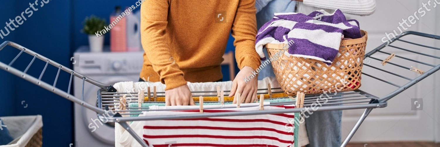 stock photo young man and woman couple hanging clothes on clothesline at laundry room 2142712845