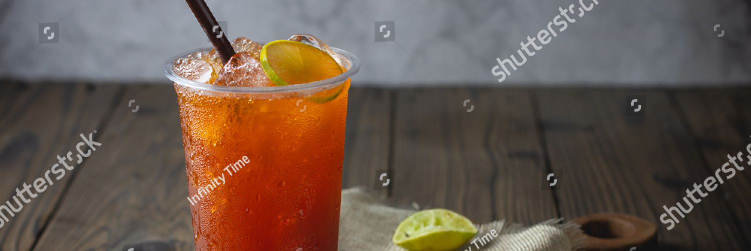 stock photo ice tea with slice of lemon in plastic cup on the wooden background 1792077143