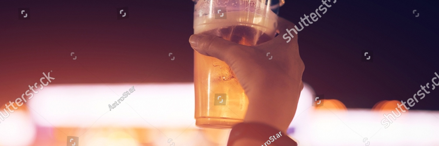 stock photo person holding cold beer plastic cup on a music festival 2073053684